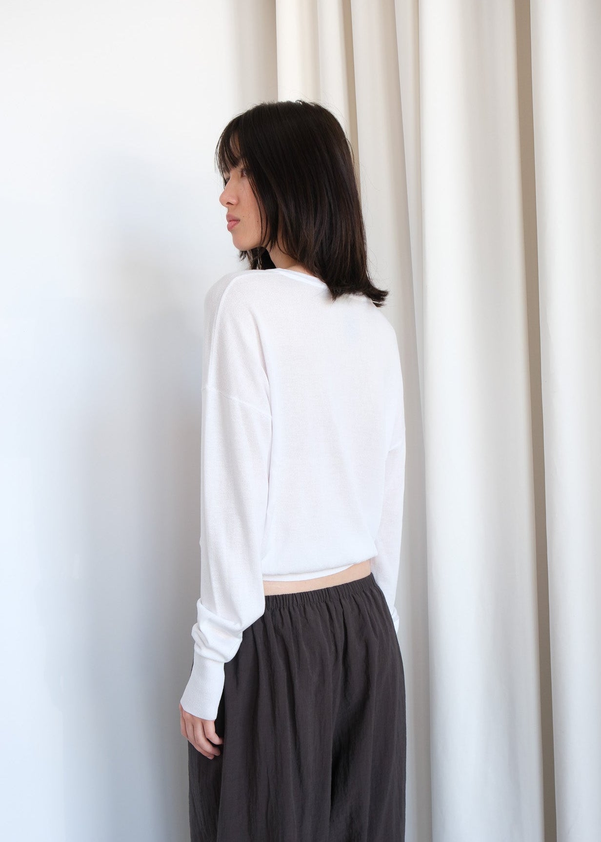 Beige Andrea sweater from geel.us, featuring a cozy knit design and ribbed cuffs, displayed on a neutral background.