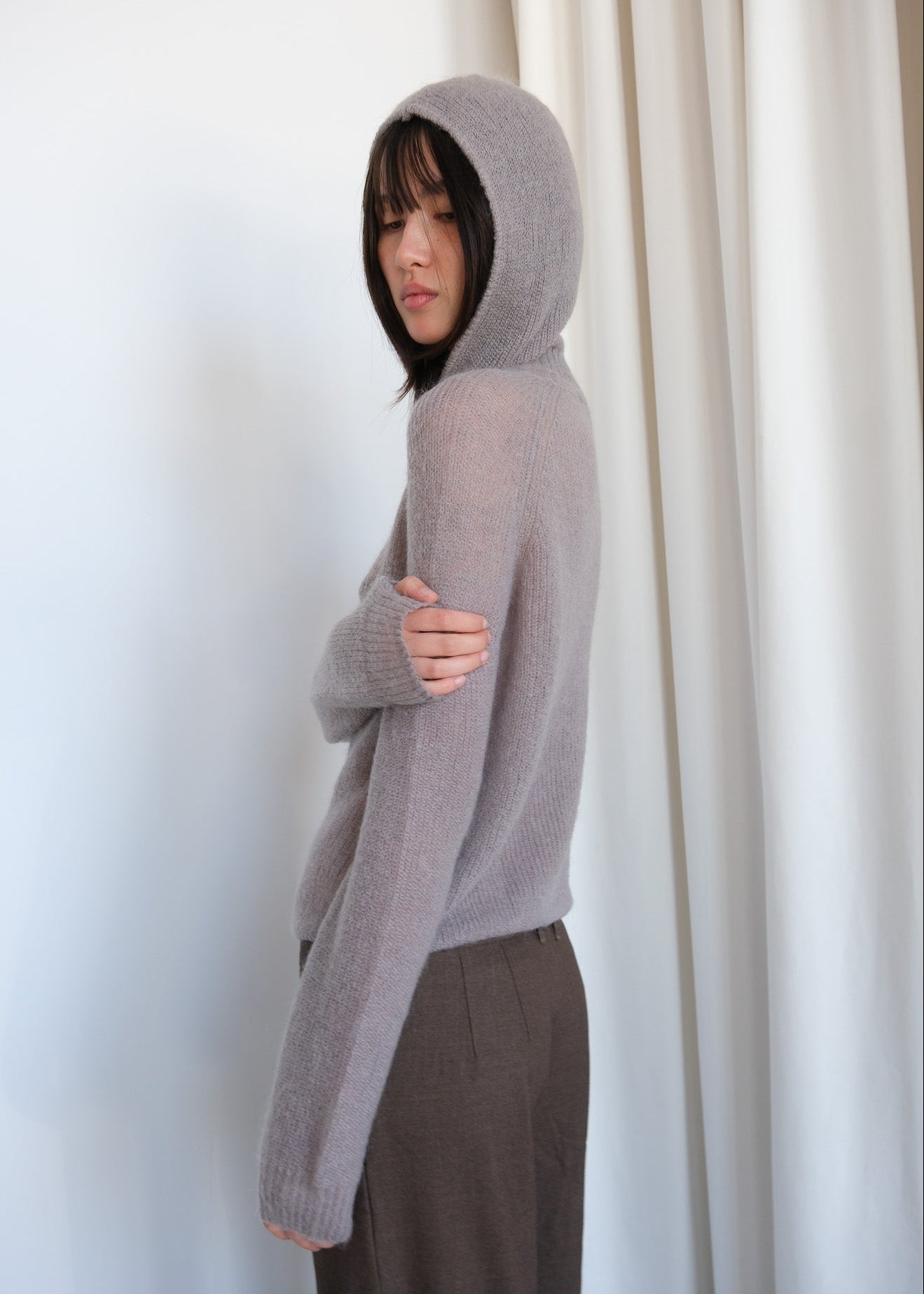 Pink Rosa sweater by Geel, cozy knit apparel with long sleeves and ribbed cuffs, displayed on a hanger.