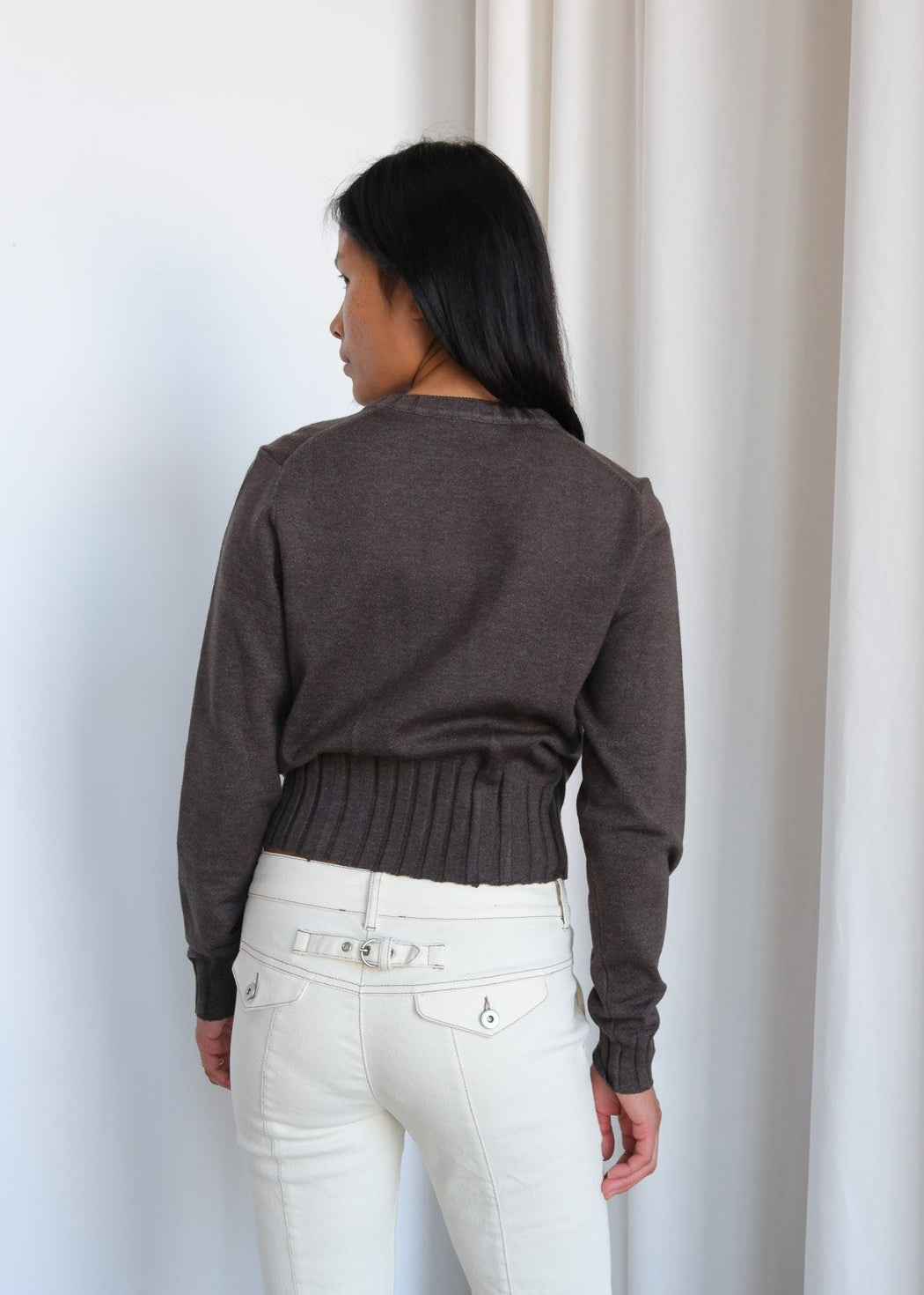 Geel Dennis Zip Cardigan in gray, featuring a full zip front and ribbed cuffs, displayed on a hanger.