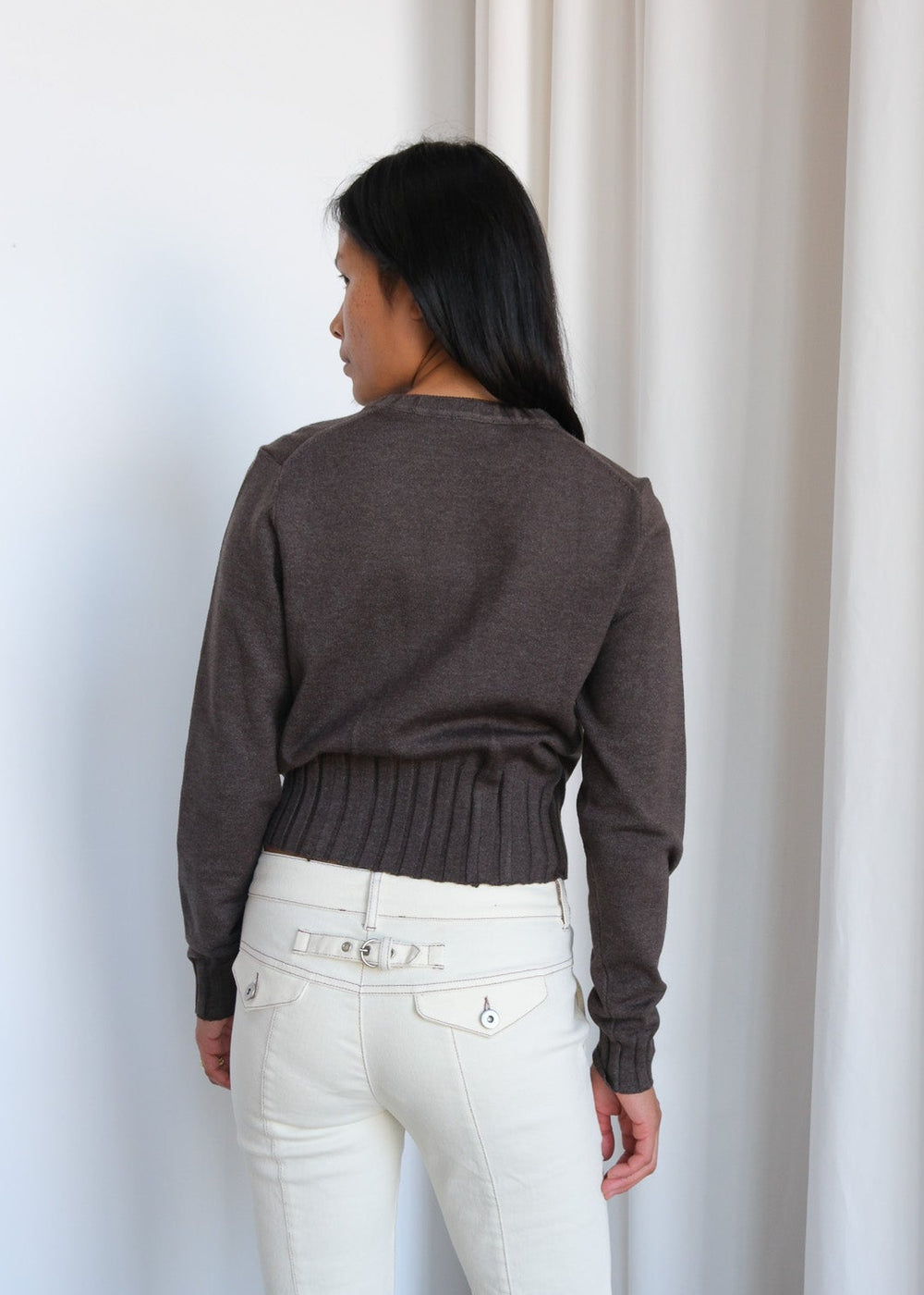 Geel Dennis Zip Cardigan in gray, featuring a full zip front and ribbed cuffs, displayed on a hanger.